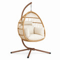 Poltrona sospesa in metallo e rattan sintetico con cuscini beige