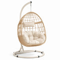 Poltrona sospesa in rattan con cuscino beige e struttura in acciaio