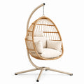 Sedia sospesa in rattan con cuscini crema